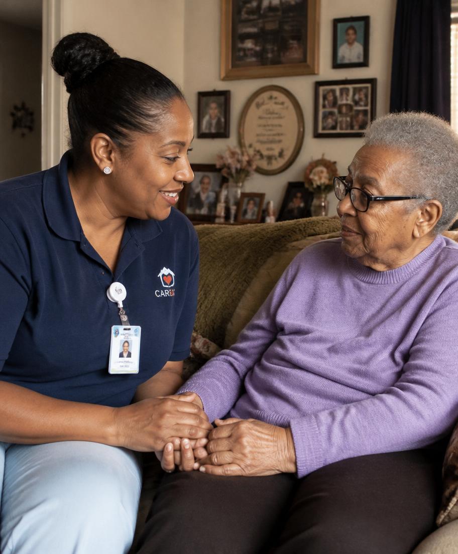 A home care provider sitting with a client
